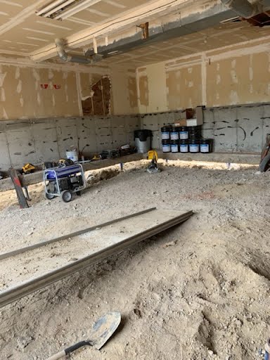 Interior slab preparation before lifting a settled garage foundation in Western Colorado