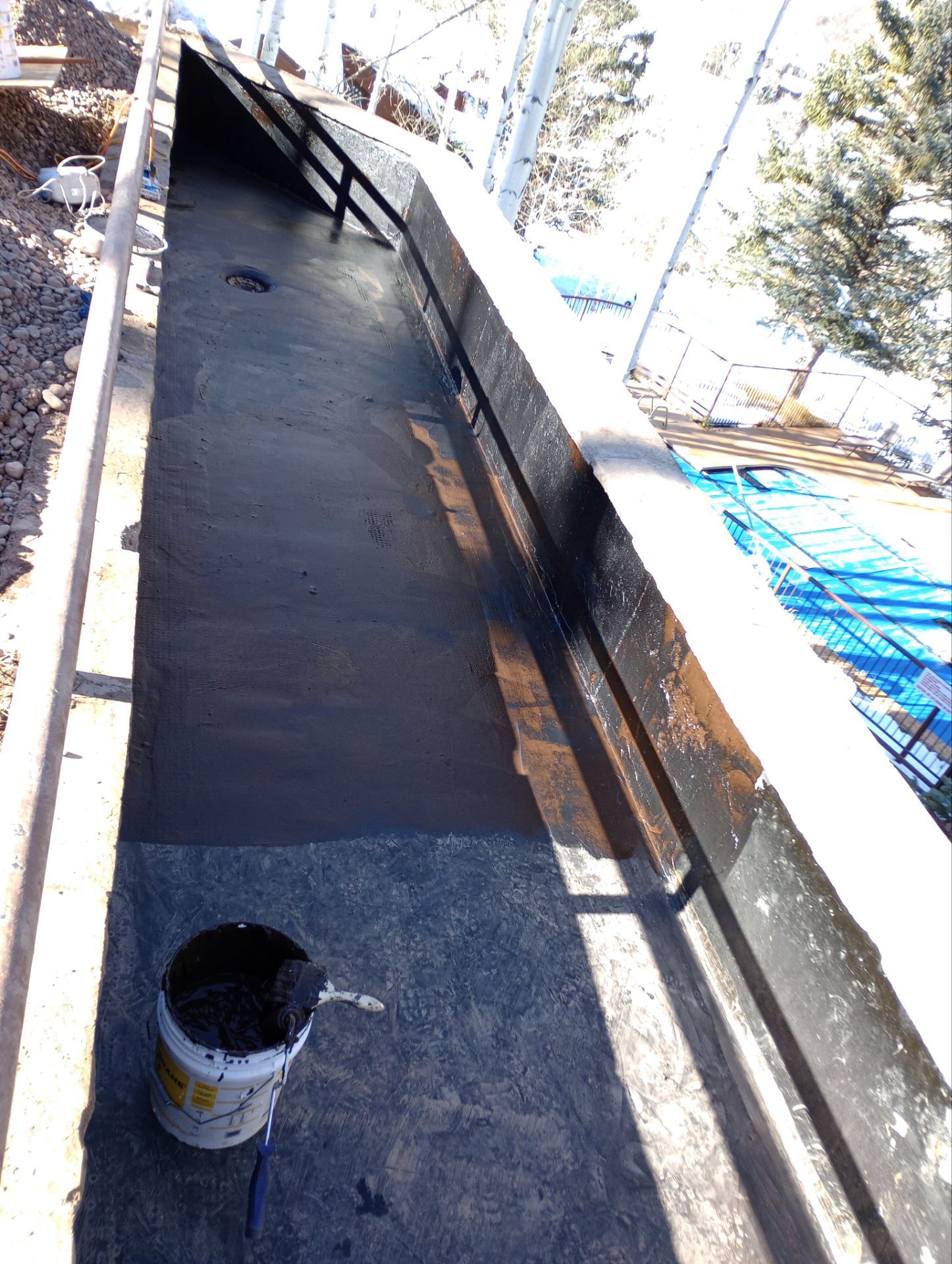 Waterproof membrane applied to a home foundation wall