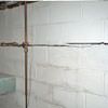 Severe foundation damage from a long crack in a bucking wall of a Gypsum home.