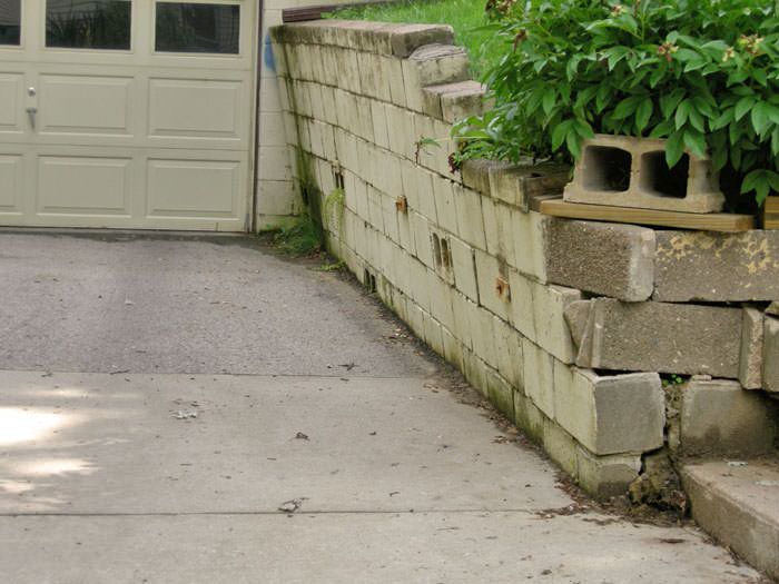 a failing retaining wall around a driveway in Aspen