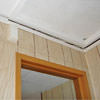 The ceiling and wall separating as the wall sinks with the slab floor in a Avon home