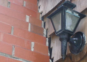 A tilting chimney in Carbondale showing serious foundation damage.