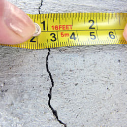 A crack in a poured concrete wall that's showing a normal crack during curing in Telluride