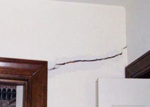 A large drywall crack in an interior wall in Clifton