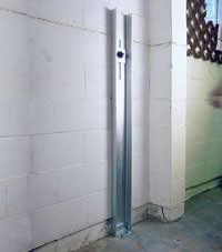 A failing foundation wall repaired with a foundation wall channel anchor system in a Durango home.