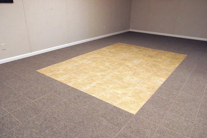 tiled and carpeted basement flooring installed in a Montrose home